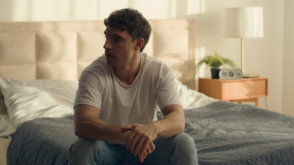 thoughtful man sitting on bed looking away 2026 09 24 08 45 06 utc